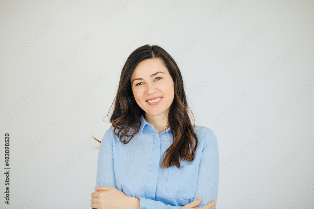Woman wearing blue shirt and smiling. Job advertisement for young people. job announcement. Woman wearing blue shirt and smiling. Job advertisement for young people. job announcement.