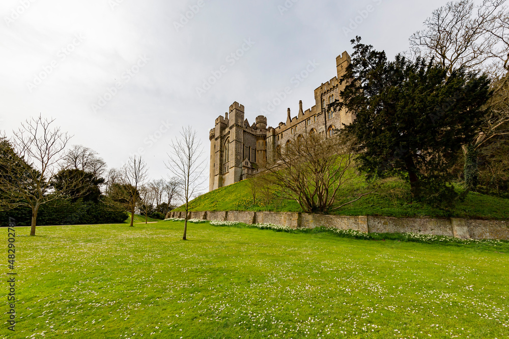 Sunny view of the garden of Arundel Castle with many flower blossom