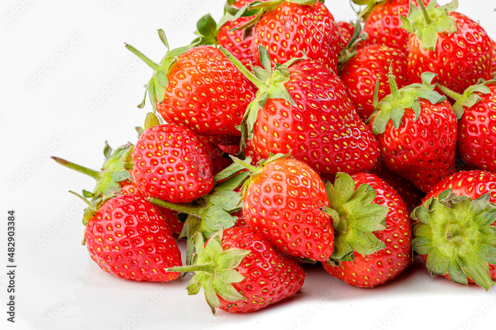 beautiful and ripe red strawberries on a white background