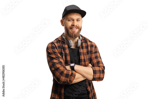 Smiling bearded guy with headphones and a cap