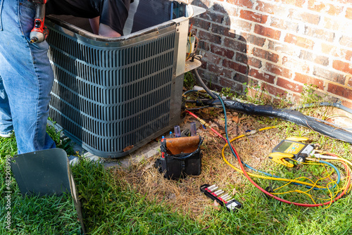 Maintenance on air conditioner unit photo