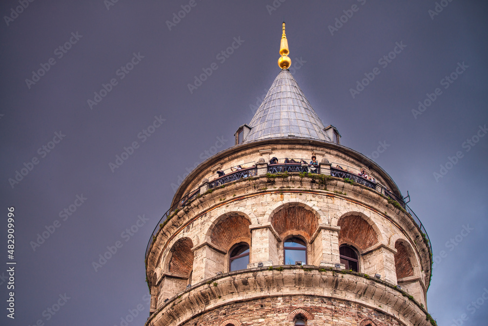 Galata Tower in Istanbul on a cloudy sunset, Turkey.