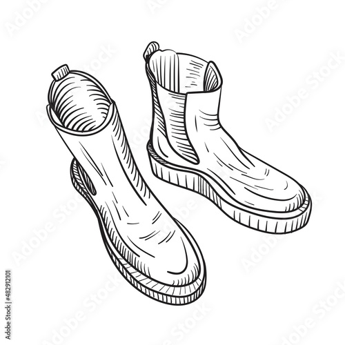 Hand drawn sketch of a pair of Chelsea boots. Vector illustration isolated on white background.
