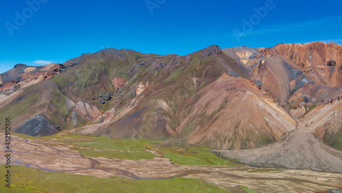 Famous Icelandic landscape in highlands, Landmannalaugar area - Iceland. Green lava fields and mountains on the background, aerial view from drone