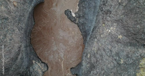 Dark river in the Payunia reserve. Nature reserve located in the province of Mendoza, Argentina.

