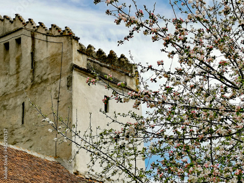 Medieval tower of the fortified church in Codlea, Transylvania in spring photo