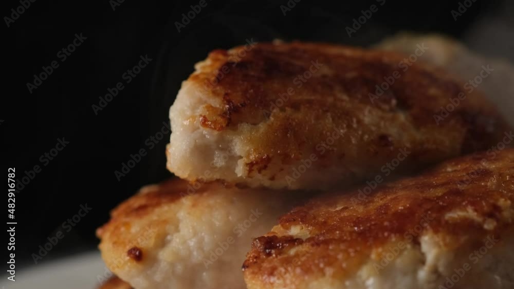 Steam coming from chicken cutlets Steam coming from chicken cutlets