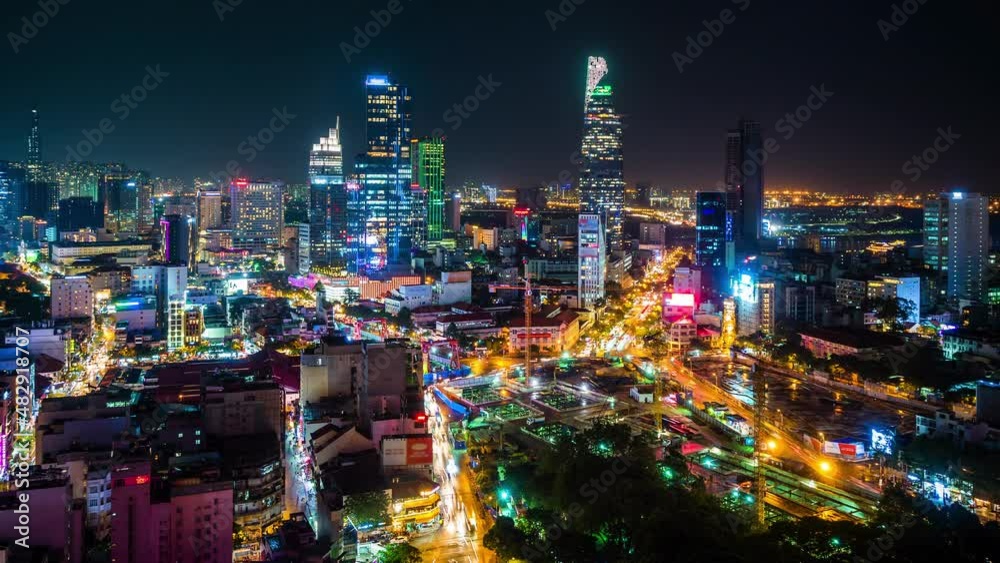Time lapse view of Ho Chi Minh City, aka Saigon, Vietnam, showing modern high rise buildings and night traffic in the financial district. Time lapse view of Ho Chi Minh City, aka Saigon, Vietnam, showing modern high rise buildings and night traffic in the financial district.