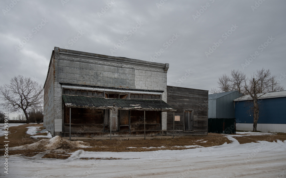 Abandoned storefronts in the shrinking rural town of Craigmyle, Alberta.