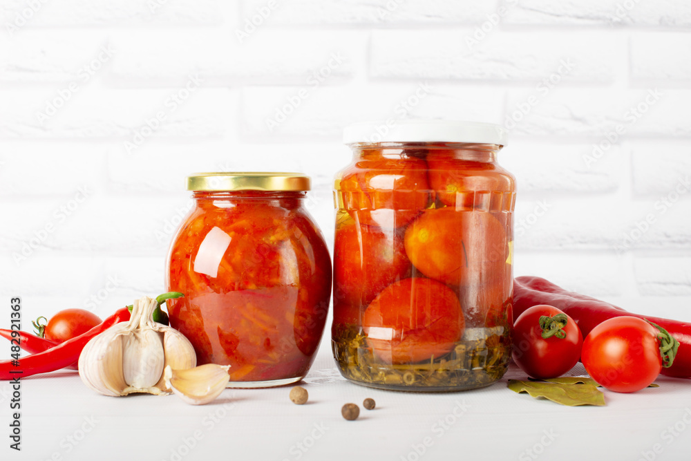 red canned, canned tomatoes in a glass jar red canned, canned tomatoes in a glass jar