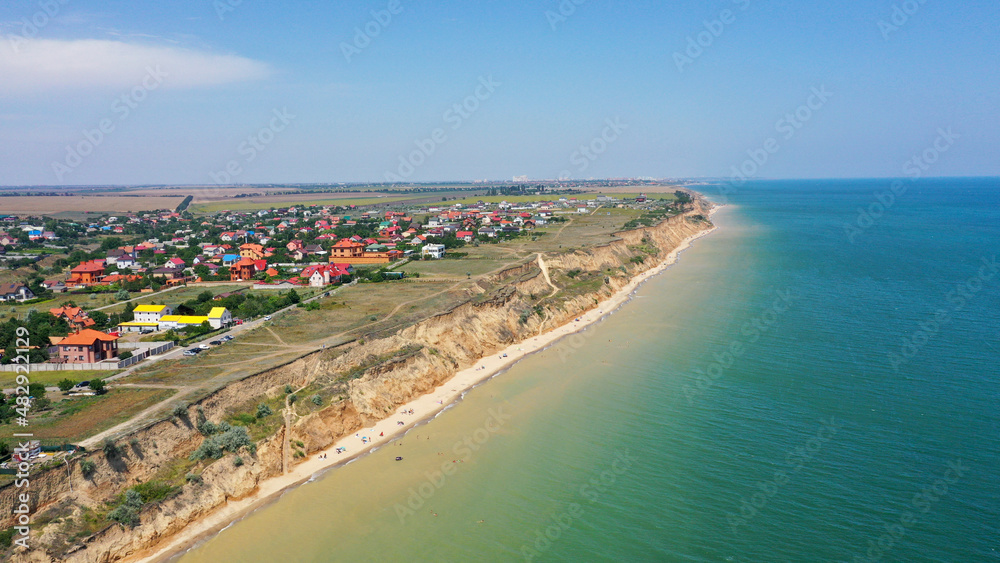 Panorama of sea shore in South Ukraine, Europe. Resort city with nice sand beach and clear blue sea. travel destination, ideal place for comfort vacation on black Sea. Drone photo