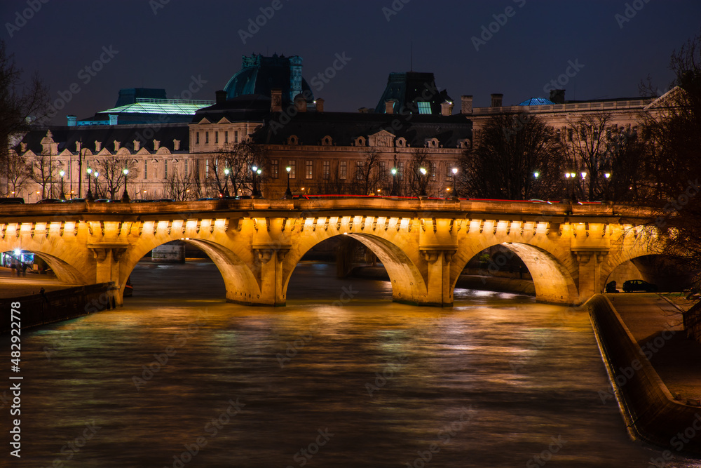 Night Paris, lights of the night city, reflection of lights in the river Seine, cityscape