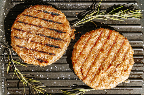 Veggie cutlet is grilled for veg burger. Vegetarian products from plant-based meat concept, beyond kitchen background