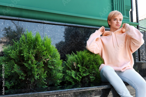 Beautiful young woman in st...