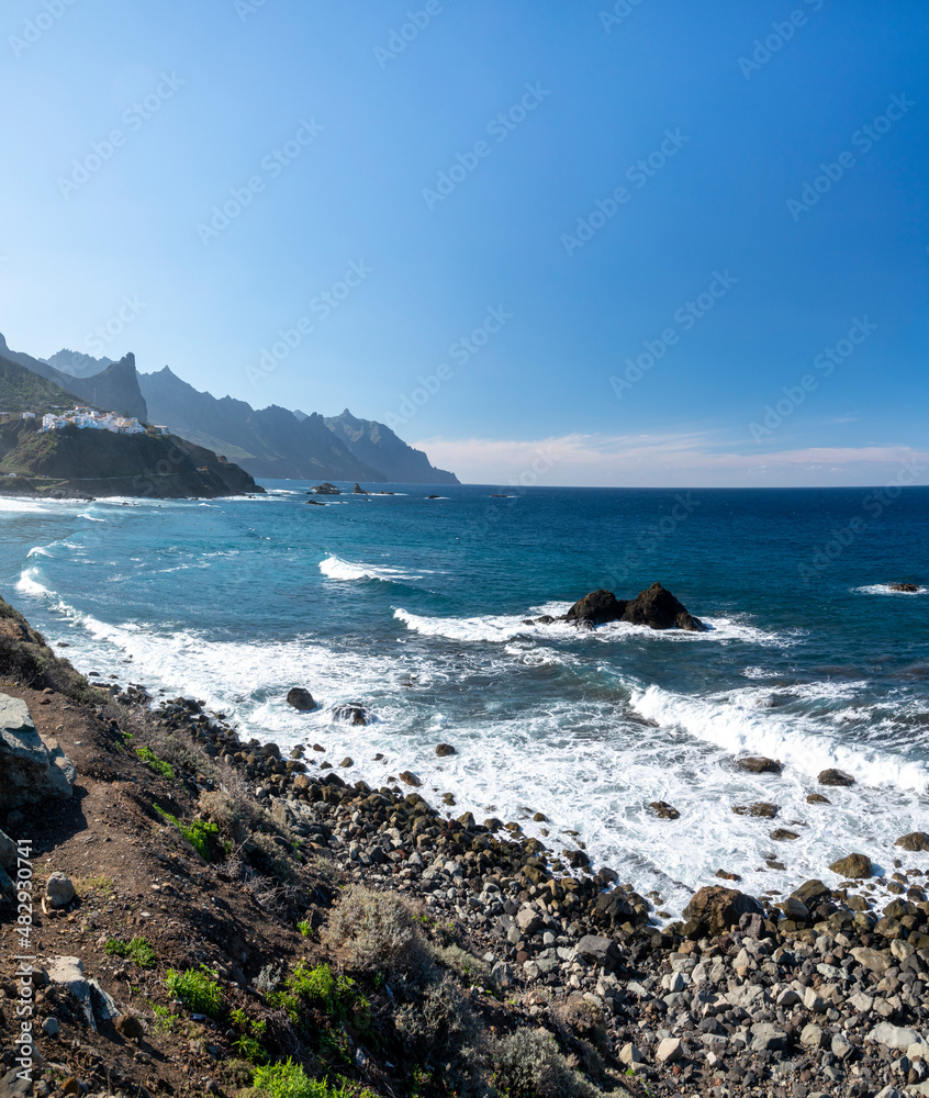 Panoramic view on lava rocks of laya de Almaciga and blue Atlantic ocean, Anaga national park near Tanagana village, North of Tenerife, Canary islands, Spain Panoramic view on lava rocks of laya de Almaciga and blue Atlantic ocean, Anaga national park near Tanagana village, North of Tenerife, Canary islands, Spain
