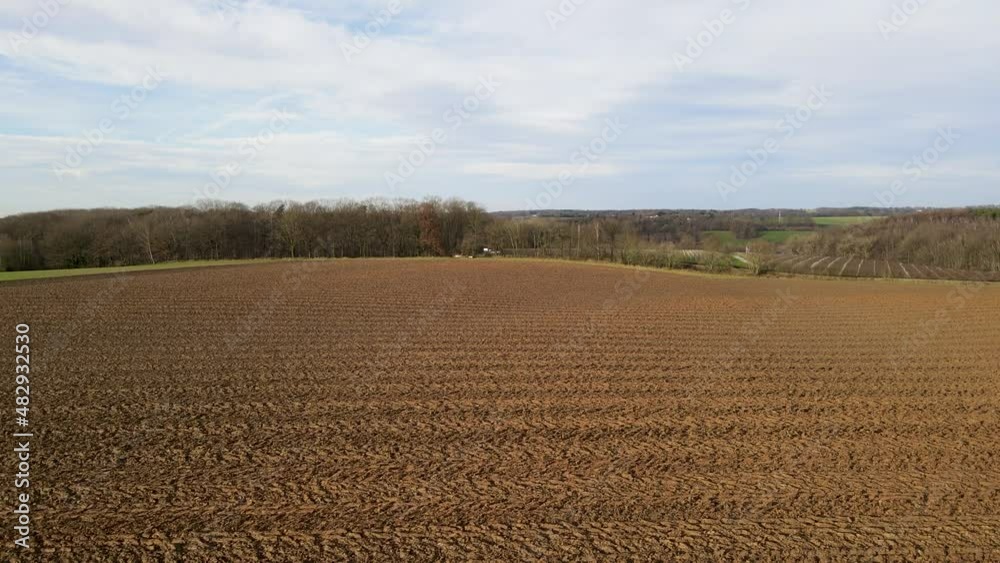 Areal view of agricultural field against cloudy sky in south of Belgium. Areal view of agricultural field against cloudy sky in south of Belgium.