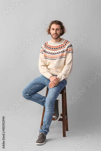 Handsome young man in knitt...