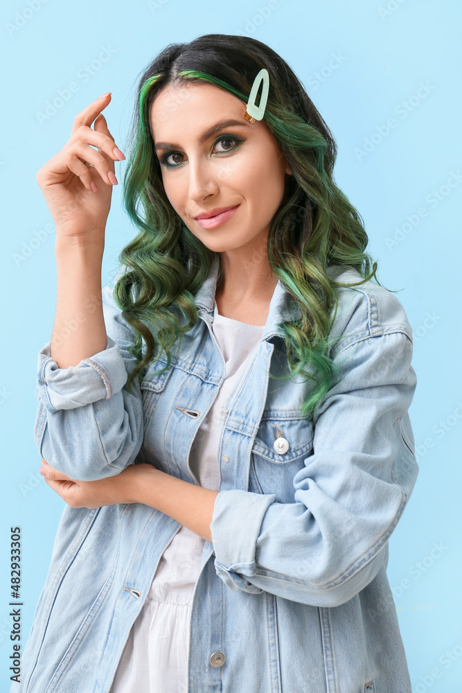 Beautiful young woman with unusual green hair on color background Beautiful young woman with unusual green hair on color background