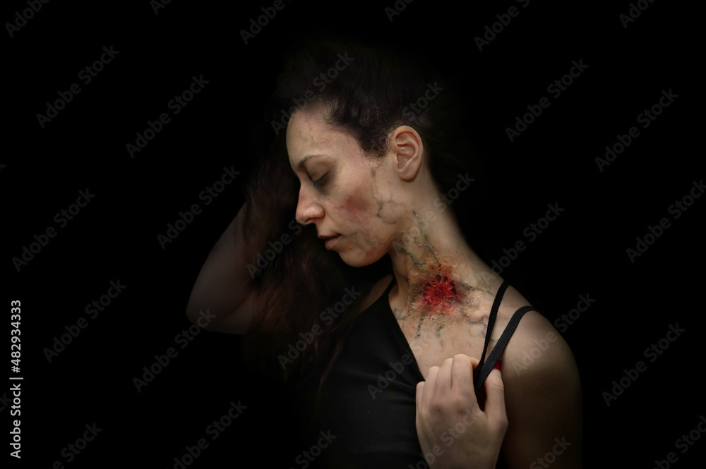 Woman bitten by zombies, halloween horror