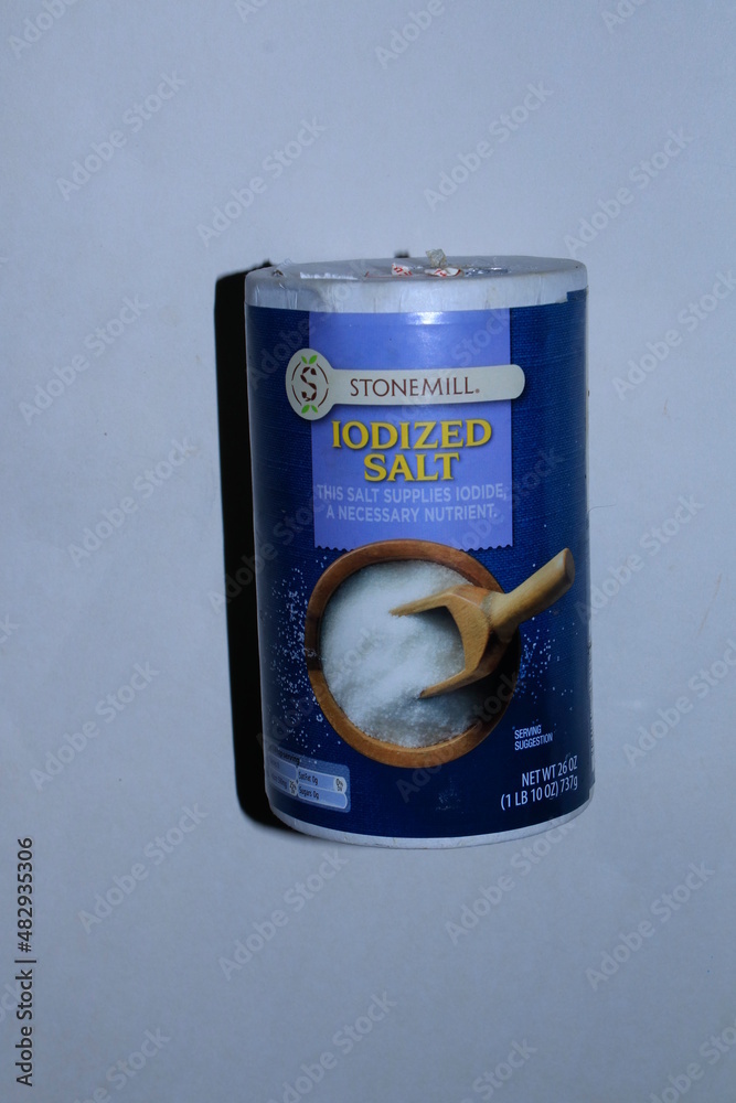StoneMill Iodized Salt shot closeup in a container in Hutchinson Kansas USA with a white