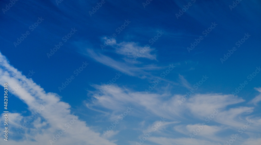 Sky clouds background, daytime blue sky with a beautiful pattern of clouds, radiance,texture for earth sky background, day, horizontal background, clear weather Sky clouds background, daytime blue sky with a beautiful pattern of clouds, radiance,texture for earth sky background, day, horizontal background, clear weather