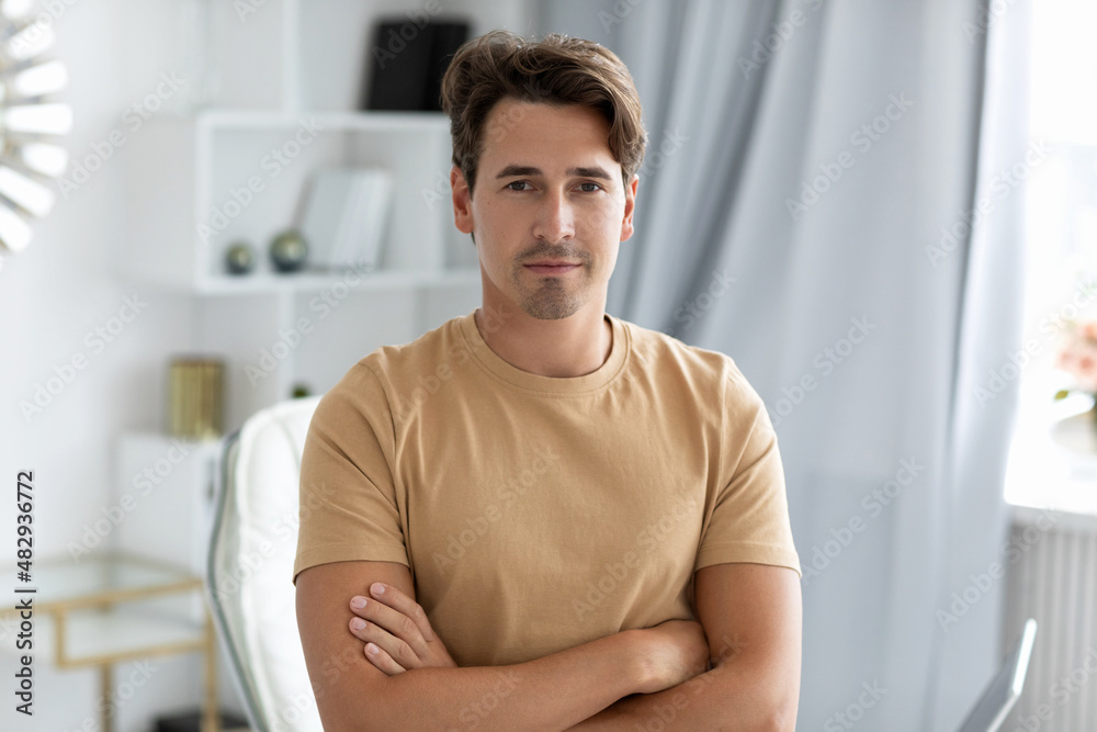Portrait of a young positive man with crossed arms Portrait of a young positive man with crossed arms