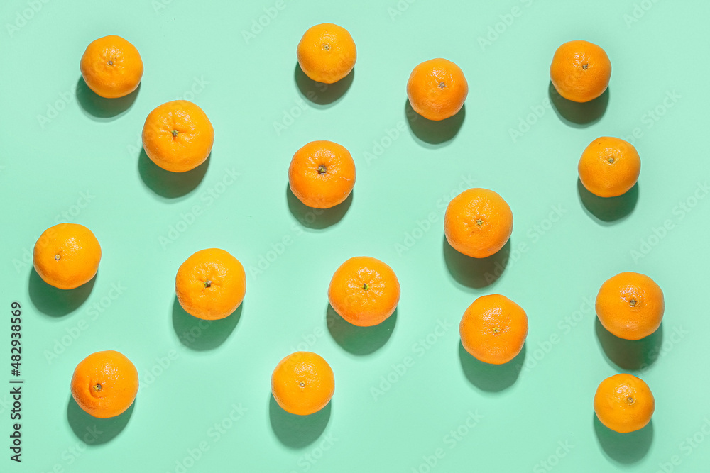 Fototapeta premium Many sweet tangerines on color background