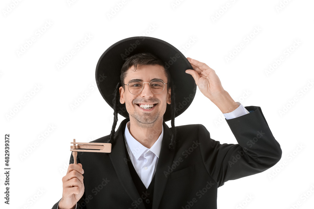 Jewish man with Purim rattle on white background Jewish man with Purim rattle on white background