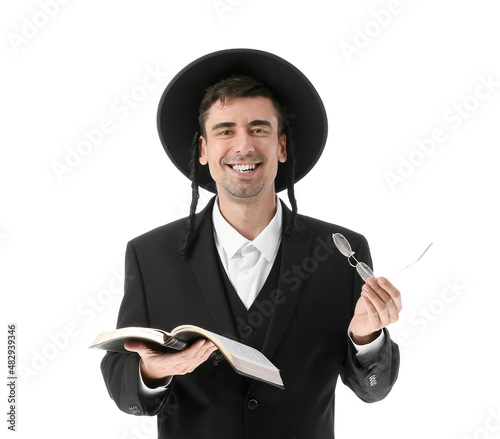 Hasidic Jewish man with Torah on white background