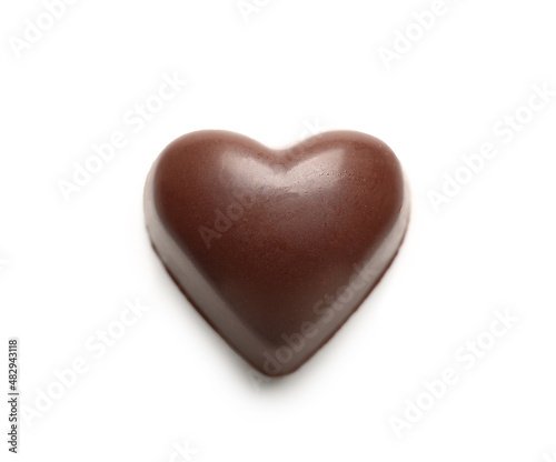 Tasty heart-shaped candy on white background