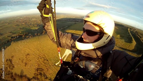 Sunset flying on a paraglider photo