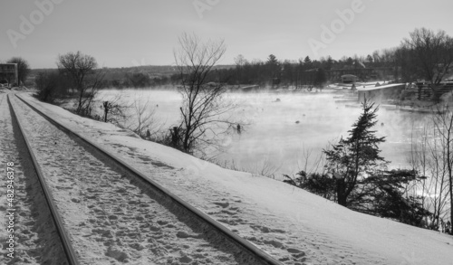 The railway between the river and the city il the Canadian winter