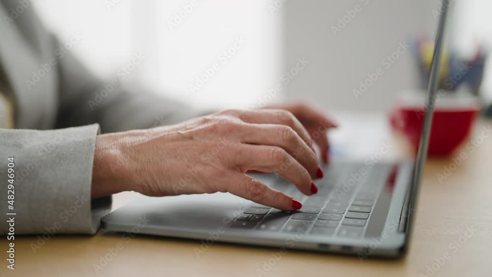 Middle age woman business worker using laptop at office Middle age woman business worker using laptop at office