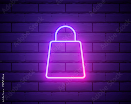 Shopping bag with handles. Shopping cart in the online store. Neon Linear Design Element. Glowing vector sign isolated on brick wall