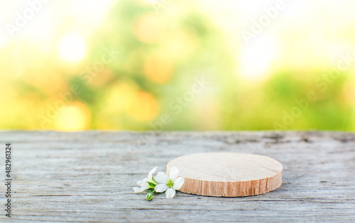 Fototapeta Naklejka Na Ścianę i Meble -  natural wooden background with a podium made of sawn wood for your eco-friendly products
