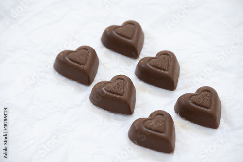 Front view of six chocolate hearts