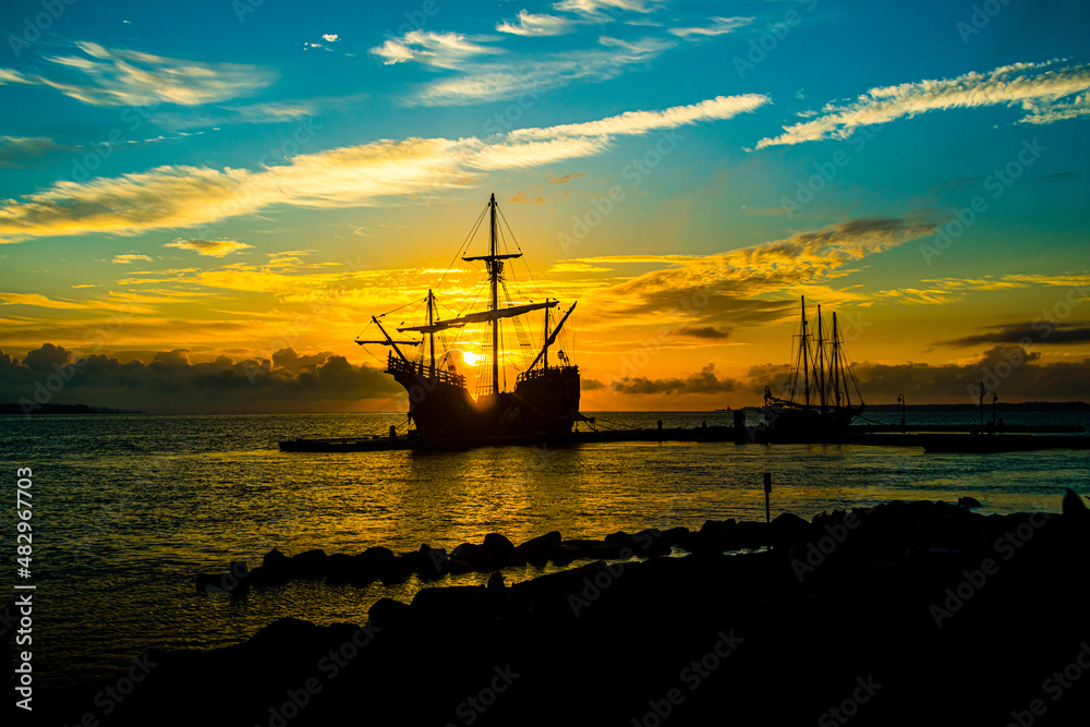 Spanish galleon docked in the bay at sunrise