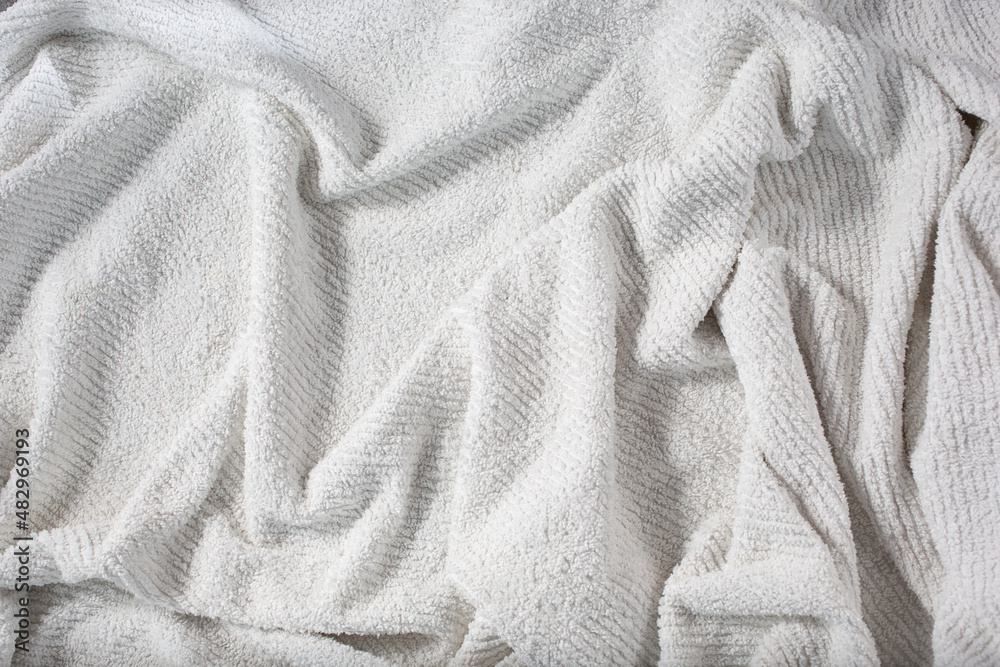 Fototapeta premium A top down view of a wrinkled towel background.