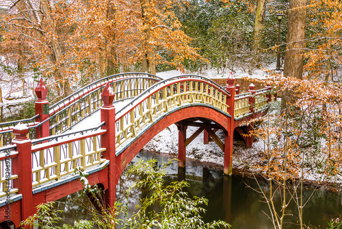bridge in autumn with snow