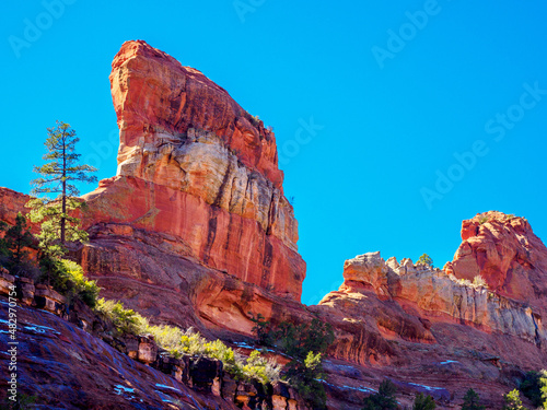 фотографія Sail-like sandstone fin, banded red-white-red