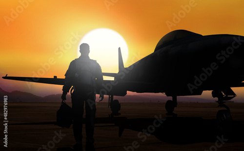 Fighter pilot walking to aboard jet fighter on airfield photo