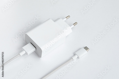 Charger and USB cable type C over white isolated background