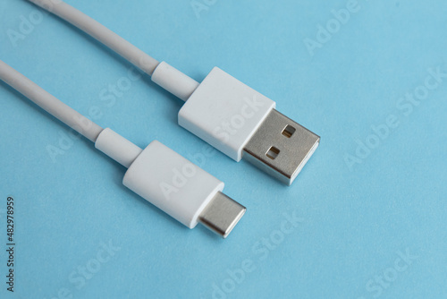 USB cable type C over blue background photo