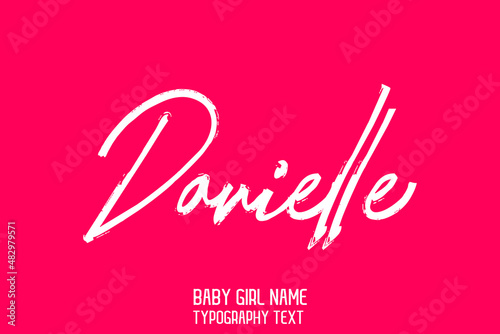 Baby Girl Name Danielle Handwritten Brush Calligraphy Text on Pink Background photo
