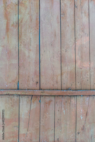 old wooden wall with faded paint 