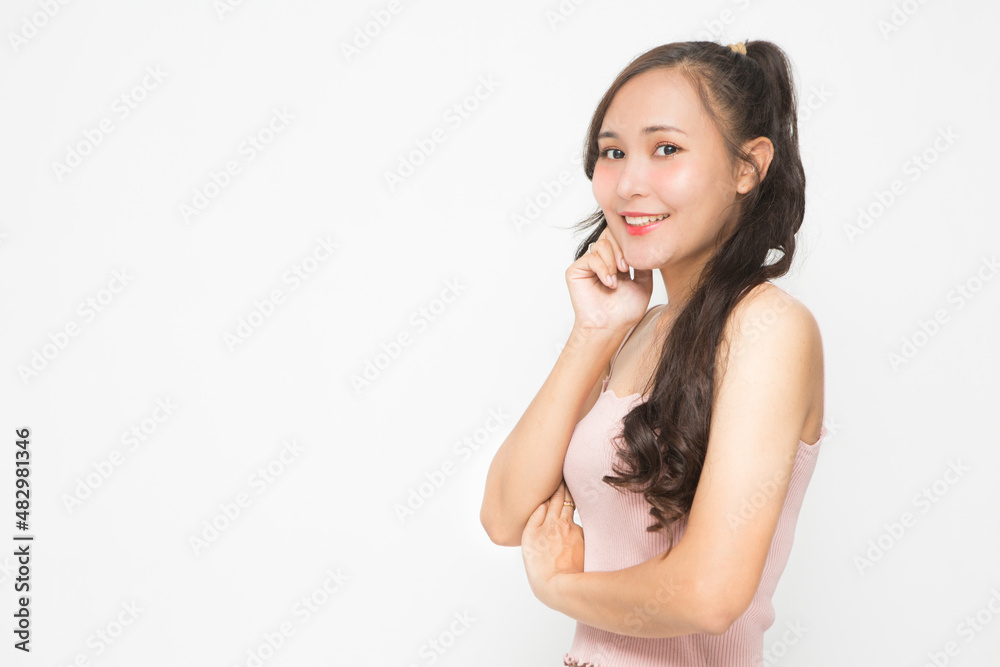 Beautiful Asian woman wearing pink casual shirt on white background and copy space.Cute Asian woman smiling and cheerful Beautiful Asian woman wearing pink casual shirt on white background and copy space.Cute Asian woman smiling and cheerful