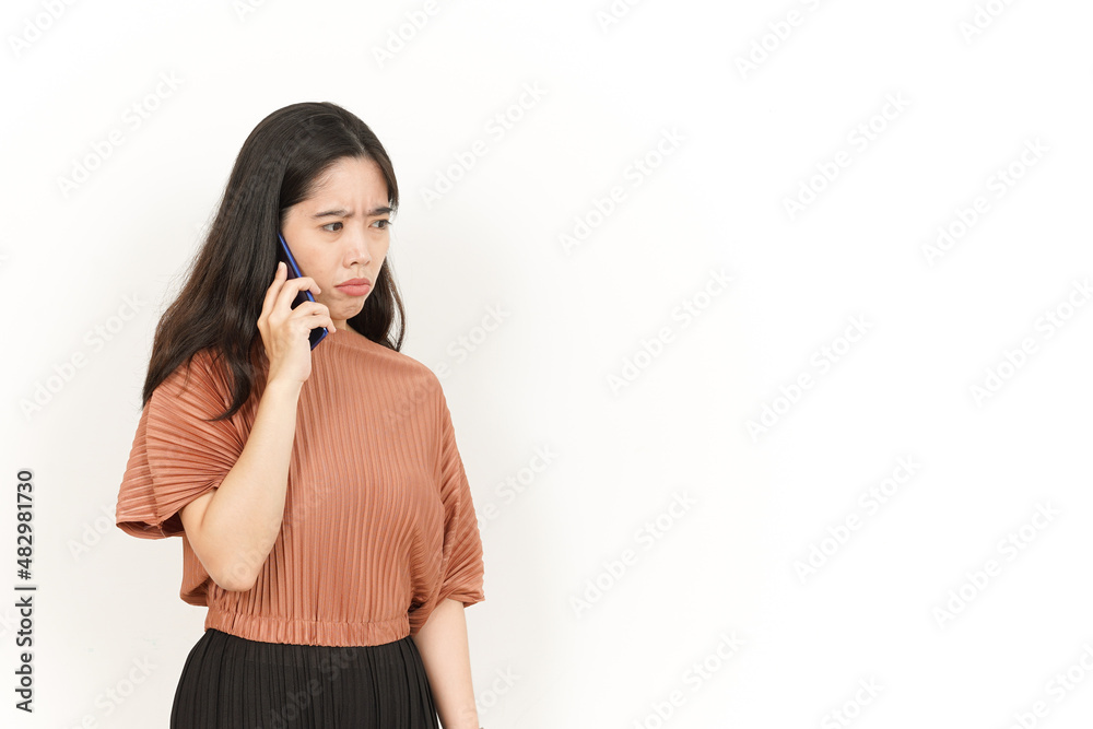 Talking on the phone and Angry Of Beautiful Asian Woman Isolated On White Background Talking on the phone and Angry Of Beautiful Asian Woman Isolated On White Background