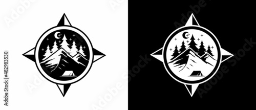 logo design in the shape of a compass with an illustration of a pine tree mountain
