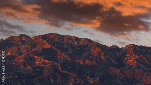 A view of the San Gabriel Mountains and clouds taken from Pasadena, shown at sunset.