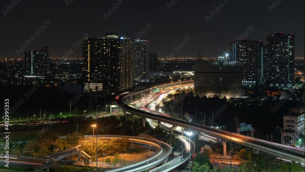 Time lapse of aerial view of highway street road at Bangkok Downtown Skyline, Thailand. Financial district and business centers in smart urban city in Asia.Skyscraper and high-rise buildings at night Time lapse of aerial view of highway street road at Bangkok Downtown Skyline, Thailand. Financial district and business centers in smart urban city in Asia.Skyscraper and high-rise buildings at night